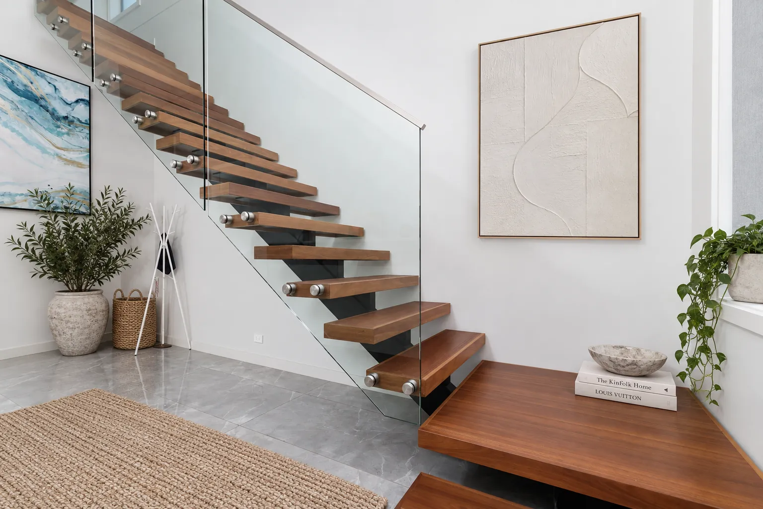 Floating timber staircase with frameless glass balustrade, at a Walter Homes project in Chatswood